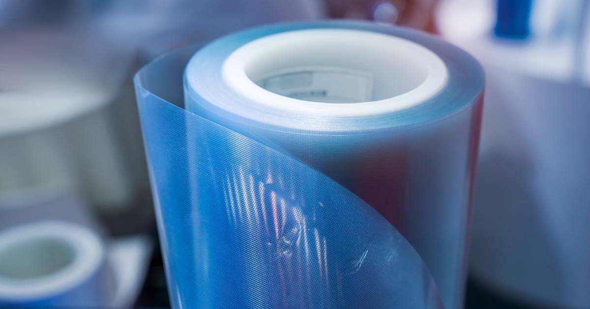 A polyethylene protective film wrapped around a tube. It has a light blue color with a reflective surface.